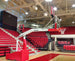 Bison T-REX International manual portable basketball system extended in full playing position in gym