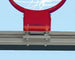 Bison glass backboard stabilizer bar close-up showing integrated support strut that absorbs rim impact